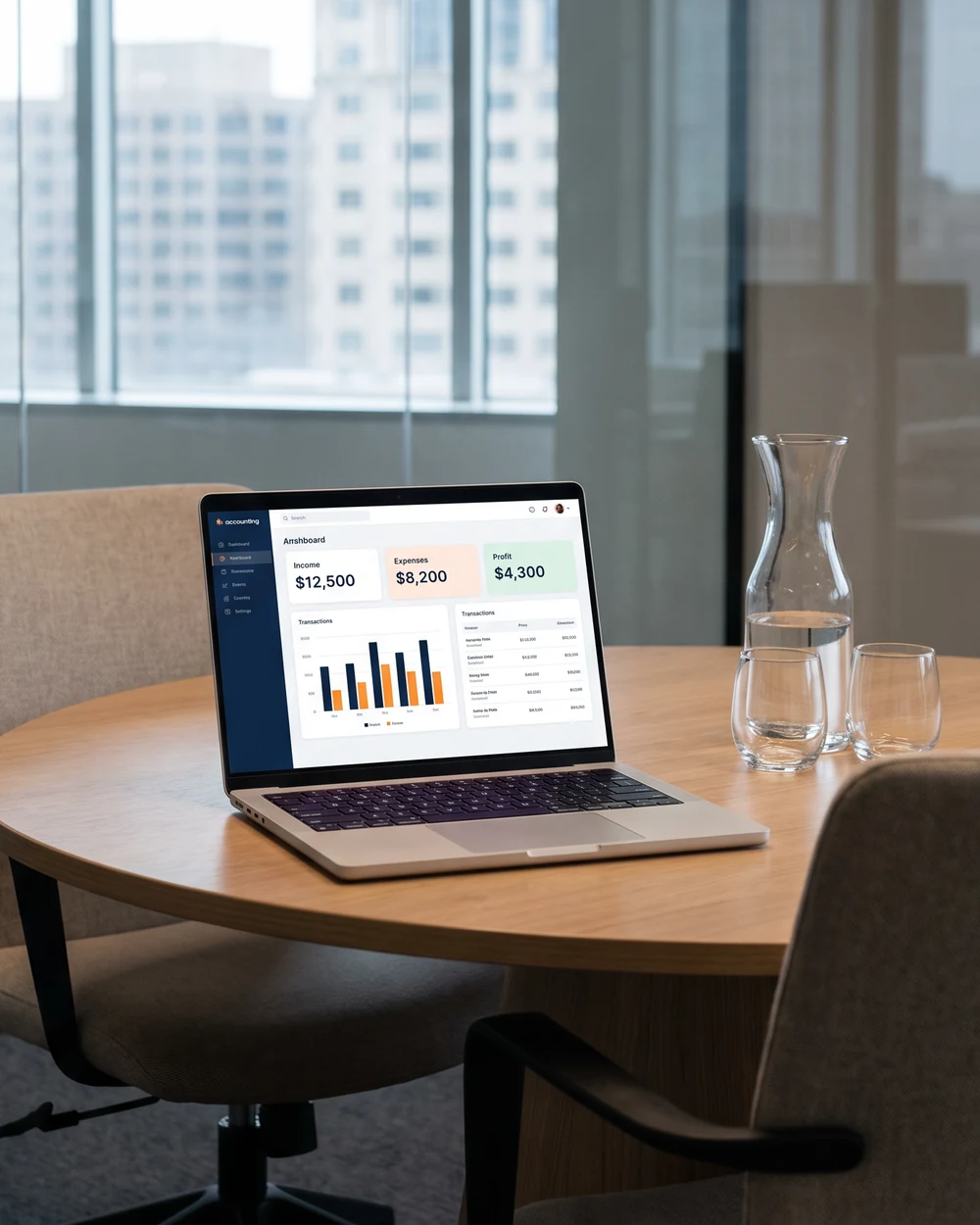 A laptop on a meeting-room table showing an accounting dashboard, city windows behind