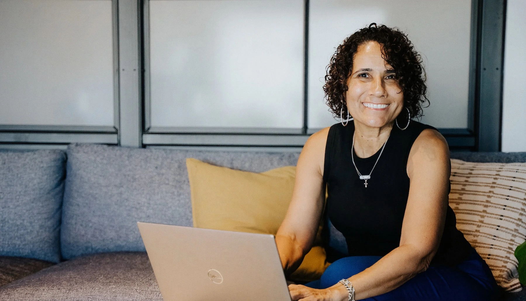 Dominique DelHomme, owner of First Things First Accounting, working at her laptop